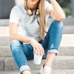 cute woman sitting on steps