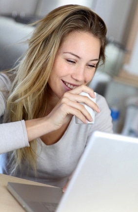 woman writing freelance articles for a paycheck