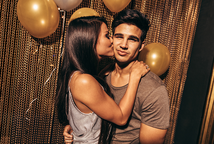 Loving young couple in the night club